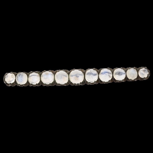 1388 - A 19th century graduated moonstone line bar brooch, unmarked silver settings, brooch length 53.9mm, ... 