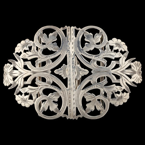 1391 - A late Victorian silver nurse's buckle, pierced and engraved floral decoration by Reynolds & Westwoo... 