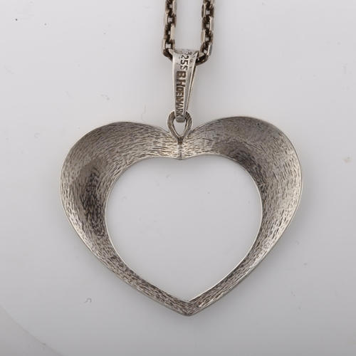 1394 - BERNHARD HERTZ - a Danish modernist sterling silver openwork heart pendant necklace, on silver cable... 