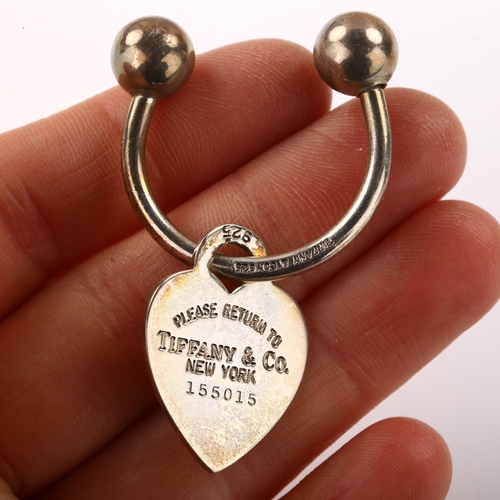 1398 - TIFFANY & CO - a sterling silver Return To Tiffany heart tag keyring, serial no. 155015, 10.4g