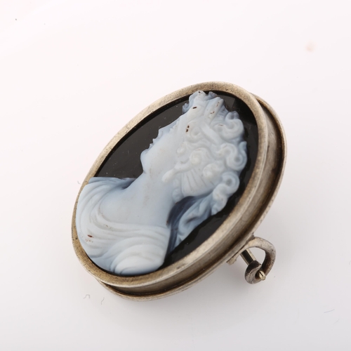 1405 - An Antique hardstone cameo brooch, unmarked white metal frame with relief carved panel depicting fem... 