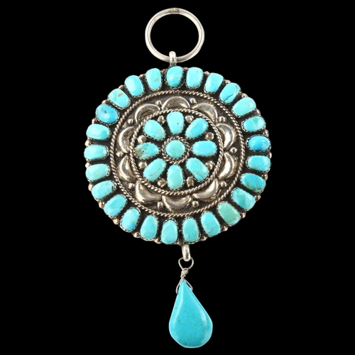 1406 - A large Native American Navajo turquoise drop pendant, unmarked silver closed-back settings, pendant... 