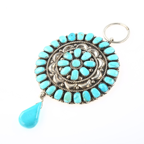 1406 - A large Native American Navajo turquoise drop pendant, unmarked silver closed-back settings, pendant... 