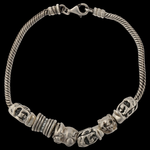 1410 - A silver snake link charm bracelet, with 6 silver charms, bracelet length 18cm, 29.1g