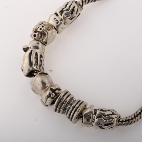 1410 - A silver snake link charm bracelet, with 6 silver charms, bracelet length 18cm, 29.1g