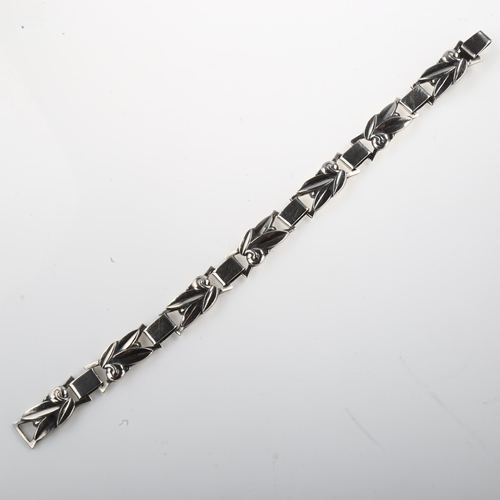 1420 - C HOLM - an Art Deco Danish silver floral panel bracelet, length 19cm, 21.6g