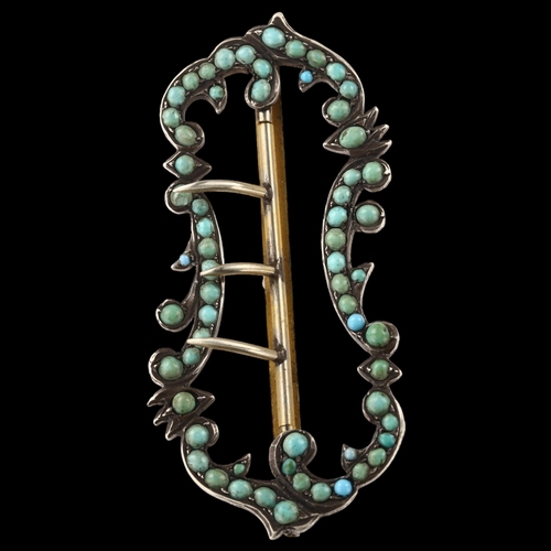 1438 - A 19th century Continental turquoise foliate buckle, unmarked silver settings, length 7cm, 14.1g