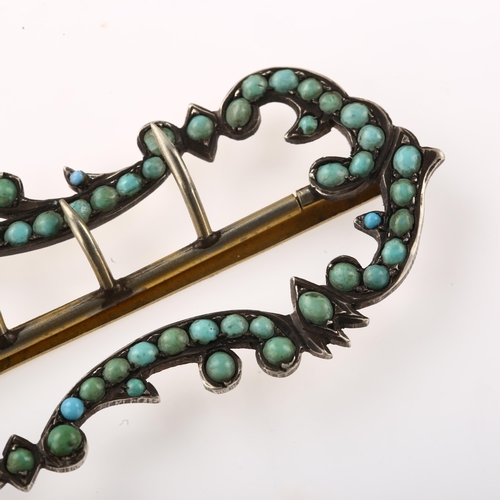 1438 - A 19th century Continental turquoise foliate buckle, unmarked silver settings, length 7cm, 14.1g