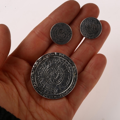 1452 - A Mexican sterling silver and 10k gold dress set, comprising pendant/brooch and 2 pairs of cufflinks... 