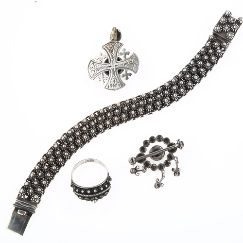 1455 - A Danish sterling silver Viking Revival demi-parure, comprising bracelet, pendant, brooch and ring, ... 