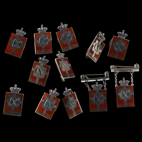 1476 - GEORG JENSEN - 12 Danish sterling silver and red enamel Kingmark badges and brooches, height 23.8mm,... 