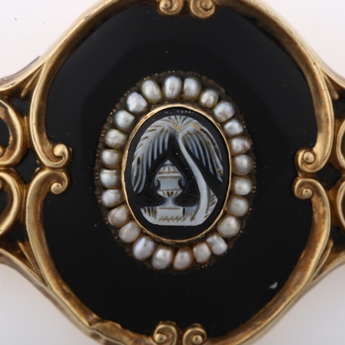 1349 - A Victorian cameo split pearl and black enamel mourning brooch, unmarked gold foliate settings with ... 