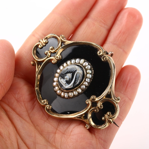 1349 - A Victorian cameo split pearl and black enamel mourning brooch, unmarked gold foliate settings with ... 