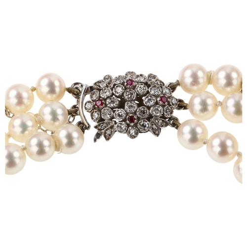 1351 - ***WITHDRAWN***  A Vintage triple-strand cultured pearl necklace, with 9ct white gold ruby and diamo... 