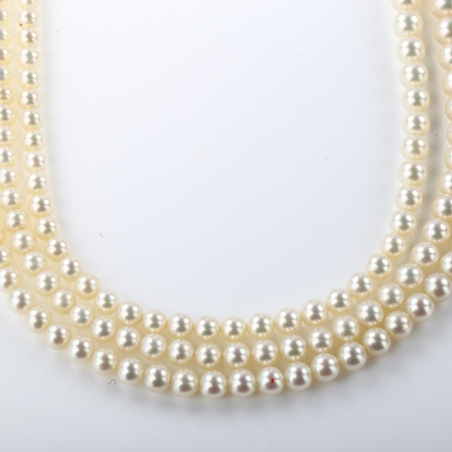 1351 - ***WITHDRAWN***  A Vintage triple-strand cultured pearl necklace, with 9ct white gold ruby and diamo... 