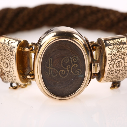 1354 - A Victorian hairwork mourning bracelet, unmarked gold closed-back settings with intricately woven tw... 