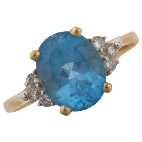 1370 - A 14ct gold blue topaz and diamond dress ring, set with oval mixed-cut topaz and modern round brilli... 