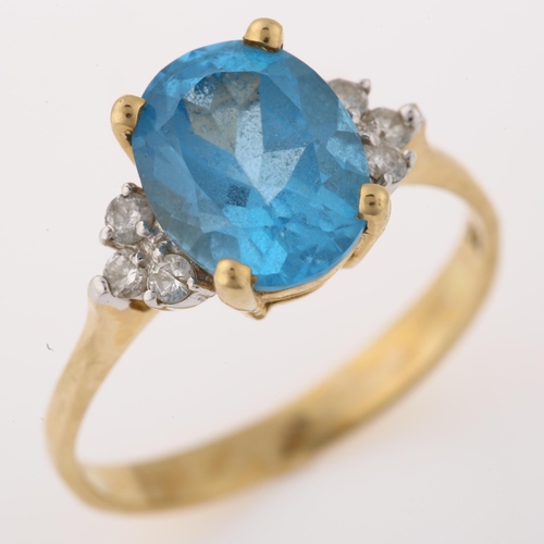 1370 - A 14ct gold blue topaz and diamond dress ring, set with oval mixed-cut topaz and modern round brilli... 