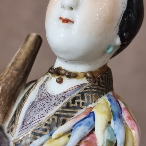 197 - A 19th century Chinese porcelain figure with fine enamel decoration, height 25cm