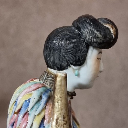 197 - A 19th century Chinese porcelain figure with fine enamel decoration, height 25cm