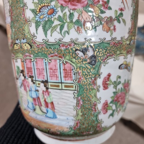 22 - A Chinese Canton famille rose ceramic rouleau vase, with hand painted and enamelled figures in court... 