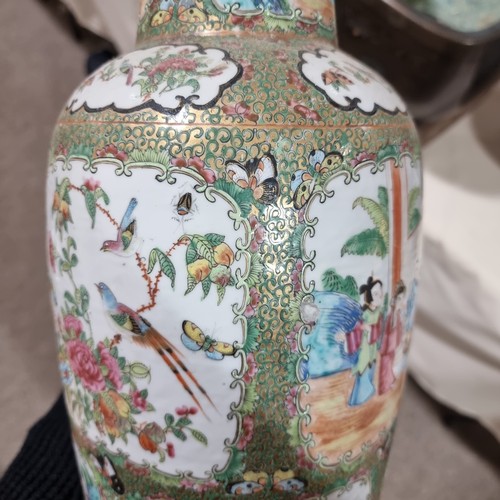 22 - A Chinese Canton famille rose ceramic rouleau vase, with hand painted and enamelled figures in court... 