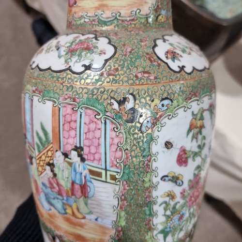 22 - A Chinese Canton famille rose ceramic rouleau vase, with hand painted and enamelled figures in court... 