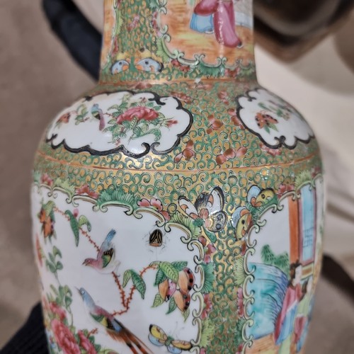 22 - A Chinese Canton famille rose ceramic rouleau vase, with hand painted and enamelled figures in court... 