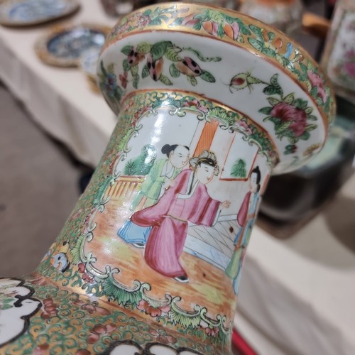 22 - A Chinese Canton famille rose ceramic rouleau vase, with hand painted and enamelled figures in court... 