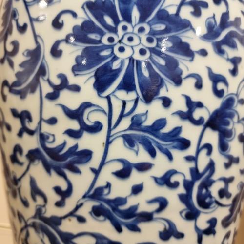 198 - A large Chinese blue and white baluster vase with floral decoration, on wooden stand, height of vase... 