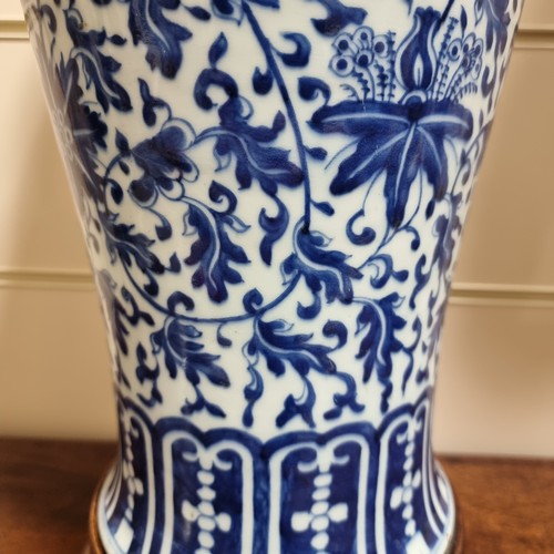 198 - A large Chinese blue and white baluster vase with floral decoration, on wooden stand, height of vase... 