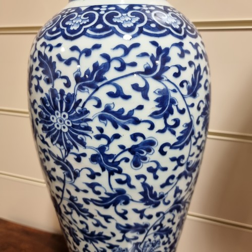 198 - A large Chinese blue and white baluster vase with floral decoration, on wooden stand, height of vase... 