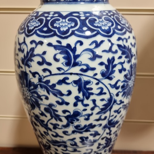 198 - A large Chinese blue and white baluster vase with floral decoration, on wooden stand, height of vase... 