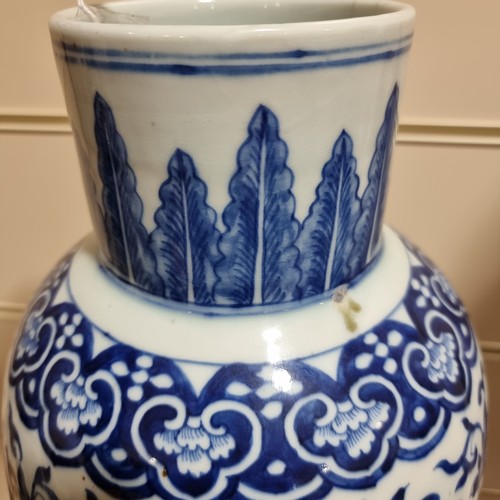 198 - A large Chinese blue and white baluster vase with floral decoration, on wooden stand, height of vase... 