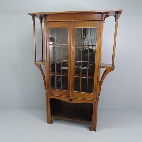 2000 - An Arts & Crafts / Art Nouveau display bookcase cabinet in the manner of Liberty & Co. 140x192x36cm.