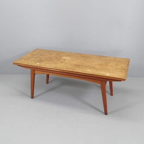 2004 - A mid-century teak metamorphic coffee /dining table, with rise and fall mechanism and two drawing le... 