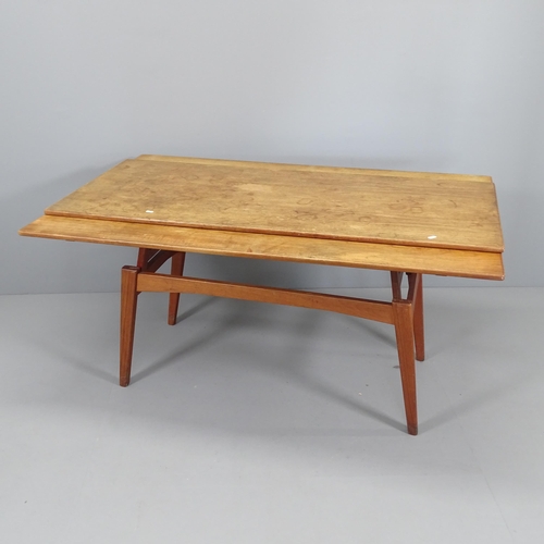 2004 - A mid-century teak metamorphic coffee /dining table, with rise and fall mechanism and two drawing le... 