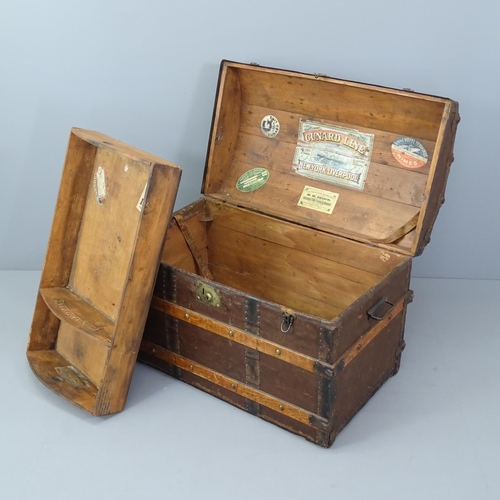 2012 - A Victorian dome top trunk, with tray fitted interior and various travel labels to the interior incl... 