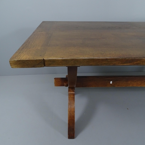 2016 - A late 20th century oak trestle dining table. 194x75x87cm