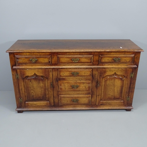 2019 - A reproduction panelled oak sideboard. 152x85x49cm