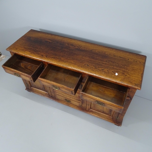 2019 - A reproduction panelled oak sideboard. 152x85x49cm