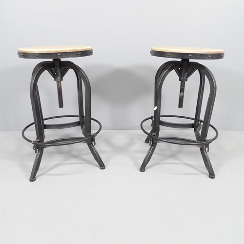 2023 - A pair of modern industrial style stools with rise and fall mechanism. Height (lowest) 69cm