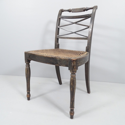 2024 - A regency ebonised cane-seated chair. In original finish. Cane A/F.