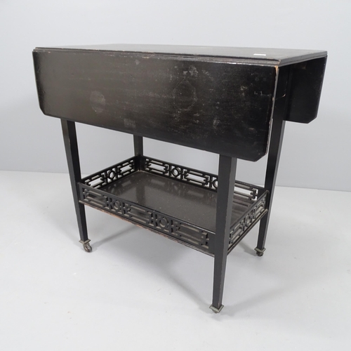 2025 - An early 20th century ebonised drop-leaf table, with galleried under-tier. 71x67x36cm (extending to ... 