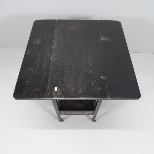 2025 - An early 20th century ebonised drop-leaf table, with galleried under-tier. 71x67x36cm (extending to ... 