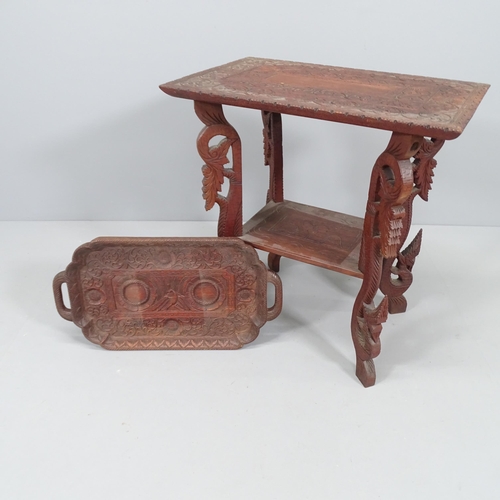 2026 - A Chinese hardwood two-tier occasional table with all-over carved decoration, 59x63x39cm, and matchi... 