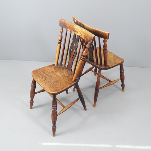 2030 - A pair of antique elm-seated dining chairs.