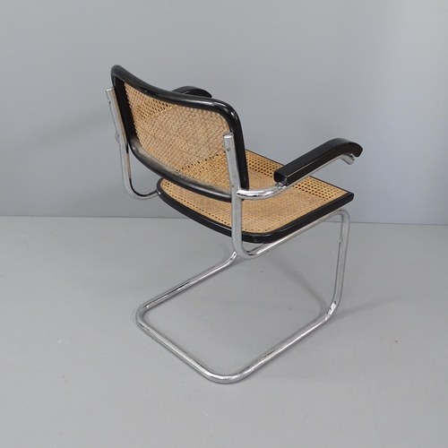 2034 - A mid-century desk chair in the manner of Marcel Breuer, on tubular steel frame with cane panels.