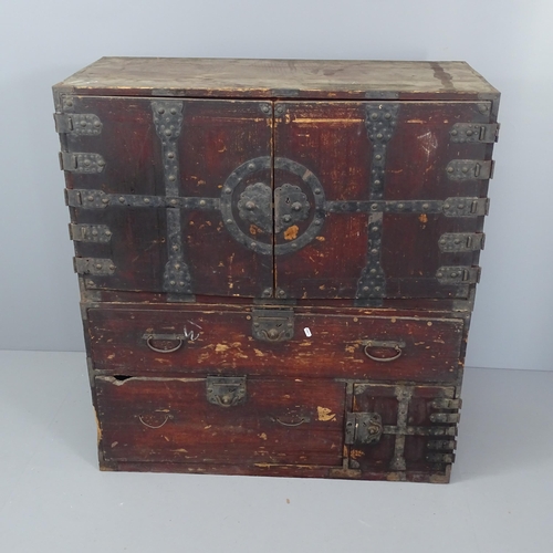 2038 - A late 20th century Japanese two section Tansu chest, the top section with two long drawers behind c... 