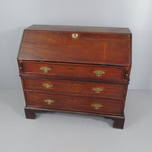 2041 - A Georgian mahogany two-section bureau, the fall front revealing a fitted interior with three long d... 